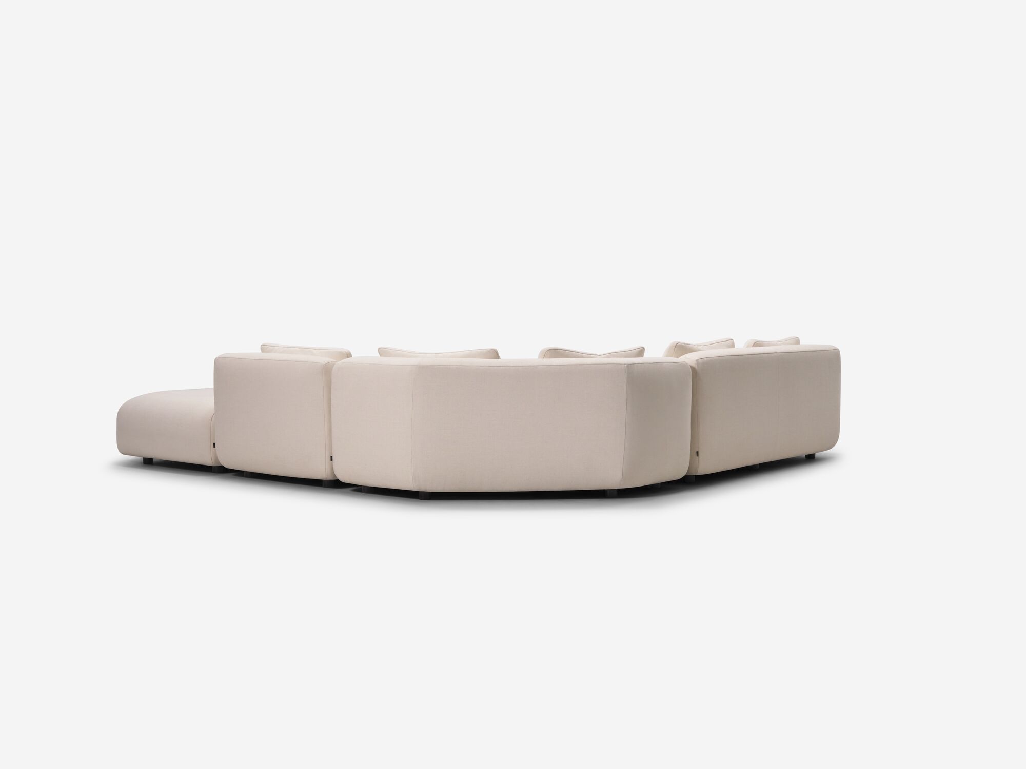 Beige armless sectional sofa back view